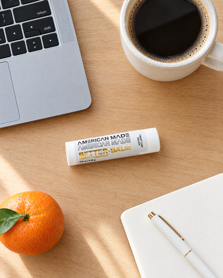 BetterBalm lip balm on a desk with coffee