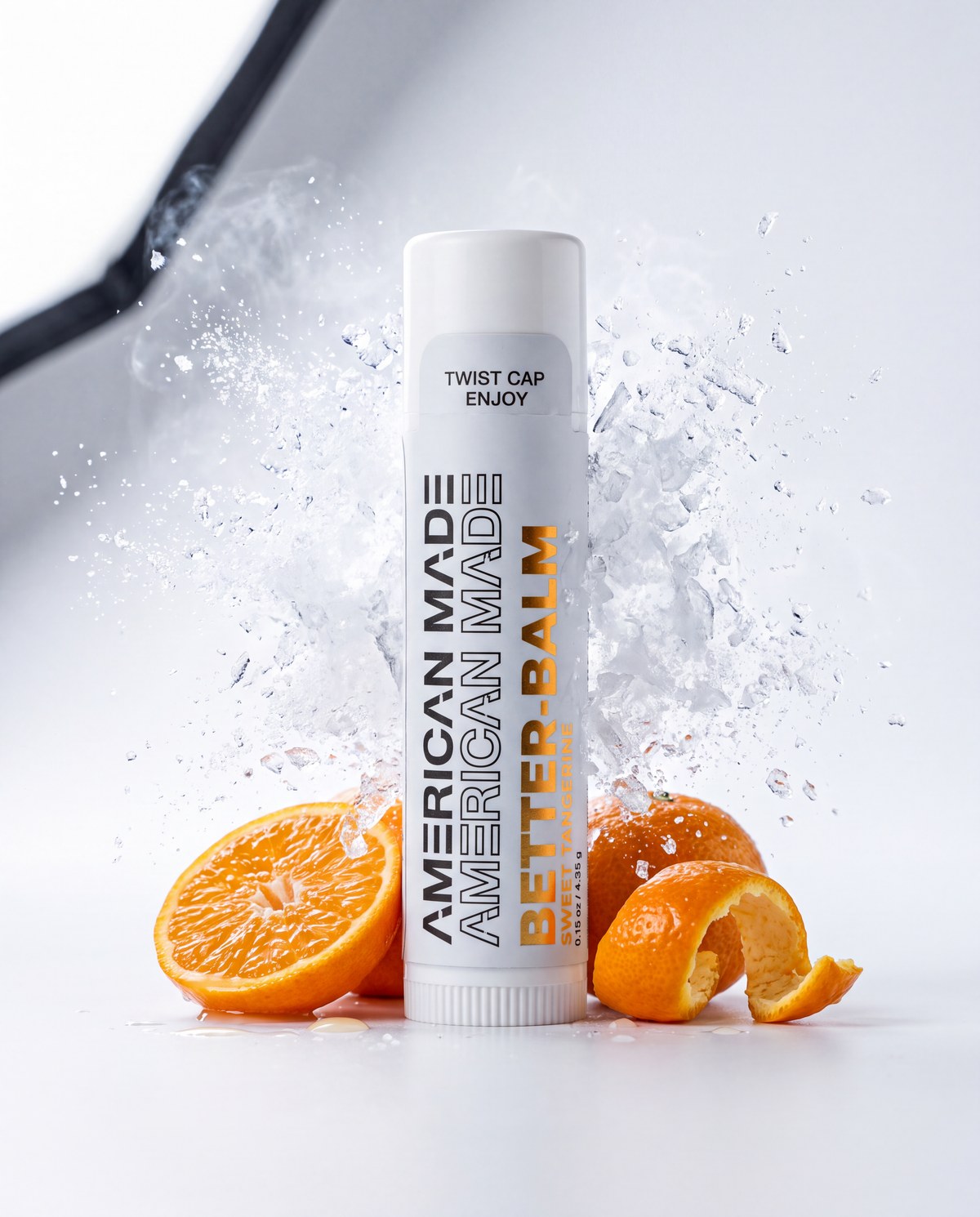 BetterBalm peptide lip balm in Sweet Tangerine with fresh tangerines and a cooling frost burst
